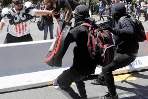 Black-clad anarchists swarm anti-hate rally in California