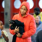 D&rsquo;Ona Spears reacts as she is told that she cannot bring her dog Missy into the shelter for flood evacuees with her daughter Natalie at the convention center in downtown Houston, Texas, on Sunday. (AP Photo/LM Otero)