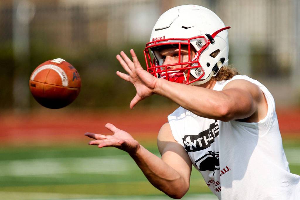 Snohomish&rsquo;s Keegan Stich catches a pass during a team practice Monday at Snohomish High School. Stich&rsquo;s vision and purposeful running style make him a threat to score any time he touches the ball for the Panthers. (Kevin Clark / The Herald)