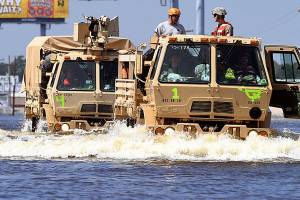 Rescuers seek anyone, alive or dead, in flooded Houston
