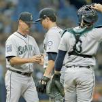 Seattle manager Scott Servais (left) takes the ball from pitcher Emilio Pagan (center) during an Aug. 19 game against Tampa Bay in St. Petersburg, Fla. Roster expansion will aid an overworked bullpen, but it might be too late to help the scuffling Mariners make the playoffs. (AP Photo/Chris O&rsquo;Meara)