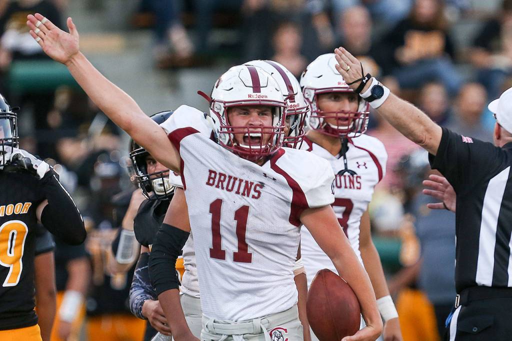 Cascade&rsquo;s Max Nelson signals a turnover during a game against Inglemoor on Aug. 31, 2017, at Pop Keeney Stadium in Bothell. (Kevin Clark / The Herald)