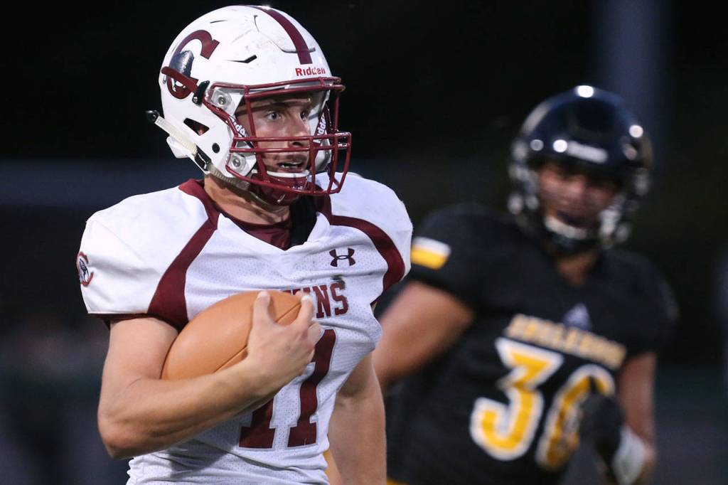 Cascade&rsquo;s Max Nelson carries the ball during a game against Inglemoor on Aug. 31, 2017, at Pop Keeney Stadium in Bothell. (Kevin Clark / The Herald)