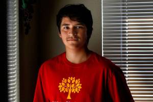 Herald Super Kid this week is Isrrael &ldquo;Izzy&rdquo; Munoz, a Cascade High School junior, Y volunteer and designer. Yep, he designed the shirt. (Dan Bates / The Herald)