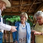 Ellen Snow, right, counts off the number of last names she&rsquo;s had while chatting with Glenn &ldquo;Clyde&rdquo; Fields and Crystal Johanson, center, as a dozen graduates plus their spouses attend Snohomish High School Class of 1942&rsquo;s 75th reunion at Hill Park on Wednesday, Sept. 6, 2017 in Snohomish, Wa. (Andy Bronson / The Herald)