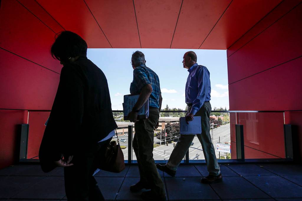 Faculty who will teach WSU medical students tour the new building where classes will be held on its Everett campus. The tour was on May 20. (Ian Terry / Herald file)