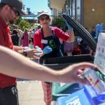 Nancy Vandenberg directs the correct sorting of waste Saturday afternoon during the Everett Food Truck festival on August 26, 2017. (Kevin Clark / The Herald)