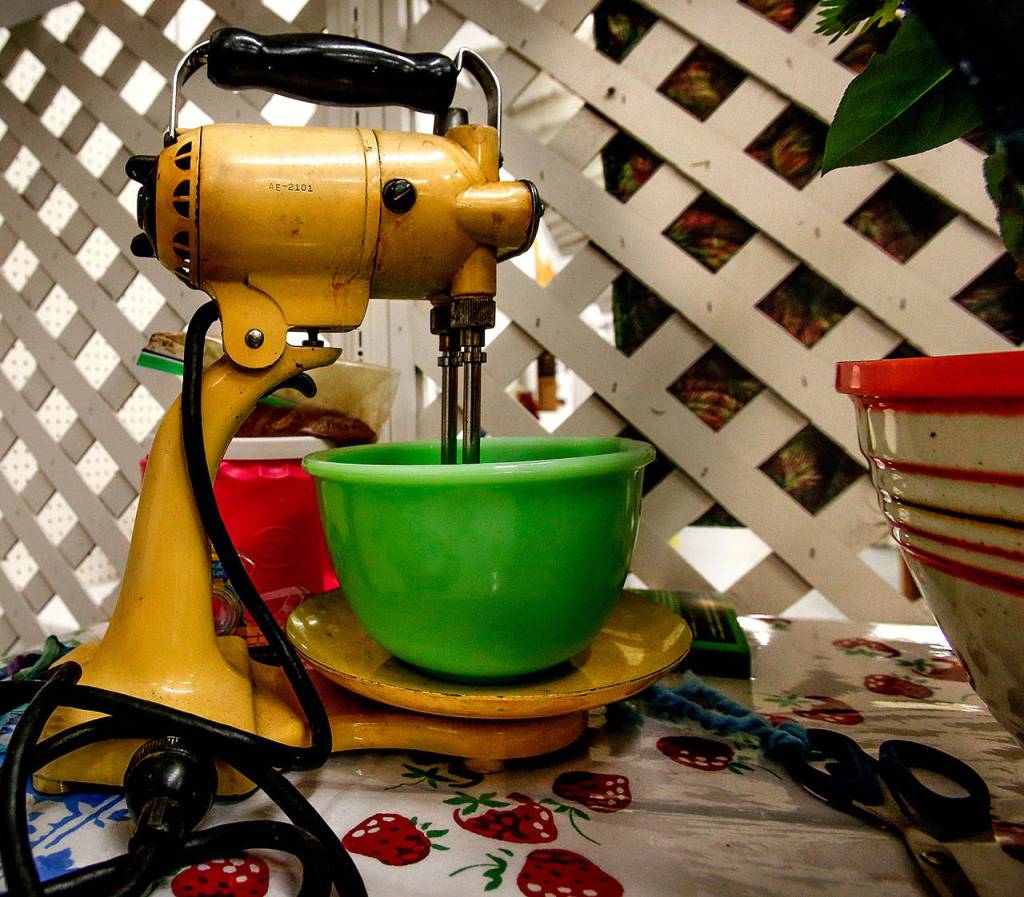 This year, Laura Elhai heads the American Heritage exhibit on the 1950s. The well-used Sunbeam mixer in that vintage display actually works, Elhai says. (Dan Bates / The Herald)
