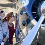 Lana Wahlberg (left) and Lisa McDonald look over a 1952 Cessna 190 Five Saturday afternoon at the Tenth Annual Vintage Aircraft Weekend at Paine Field on September 02, 2017. (Kevin Clark / The Herald)