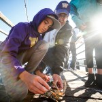 Noah Edwards (left), of Mukilteo, checks out a crab he caught with his grandfather Steve Edwards, of Snohomish, during the annual fishing derby at the Mukilteo Lighthouse Festival last year. &ldquo;He&rsquo;s a fishing machine,&rdquo; Steve said about his grandson. The 52nd annual festival is Sept. 8-10 at Mukilteo Lighthouse Park. (Ian Terry / Herald file)