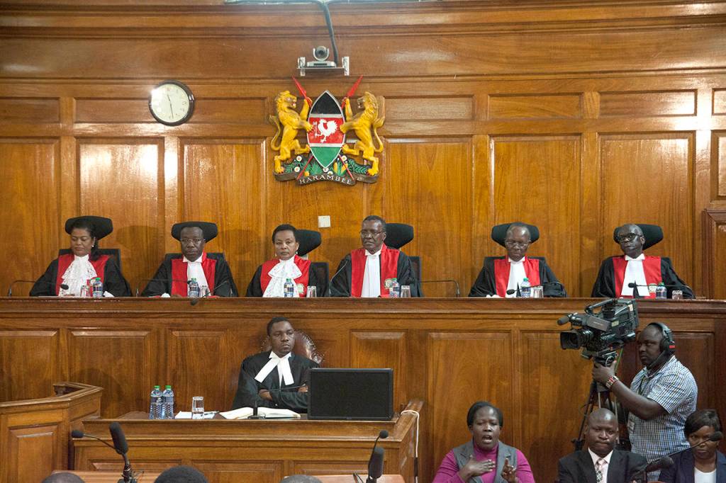 Kenyan Supreme Court judges (L-R) Njoki Ndung&rsquo;u, Jackton Ojwang, Deputy Chief Justice Philomela Mwilu, Chief Justice David Maraga, Smokin Wanjala and Isaac Lenaola preside to deliver the election petition judgement Friday in Nairobi, Kenya. (AP Photo/Sayyid Abdul Azim)
