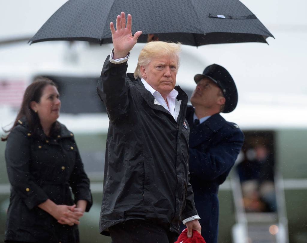 President Donald Trump and first lady Melania Trump walk towards Air Force One at Andrews Air Force Base in Md., Saturday, Sept. 2, 2017. The President is heading to Houston and Lake Charles, Louisiana to survey Harvey&rsquo;s devastation. AP Photo/Susan Walsh)