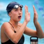 Edmonds-Woodway&rsquo;s Morgan Broadhead talks with teammates during practice Sept. 6, 2017, at Klahaya Swim and Tennis Club in Edmonds. (Kevin Clark / The Herald)