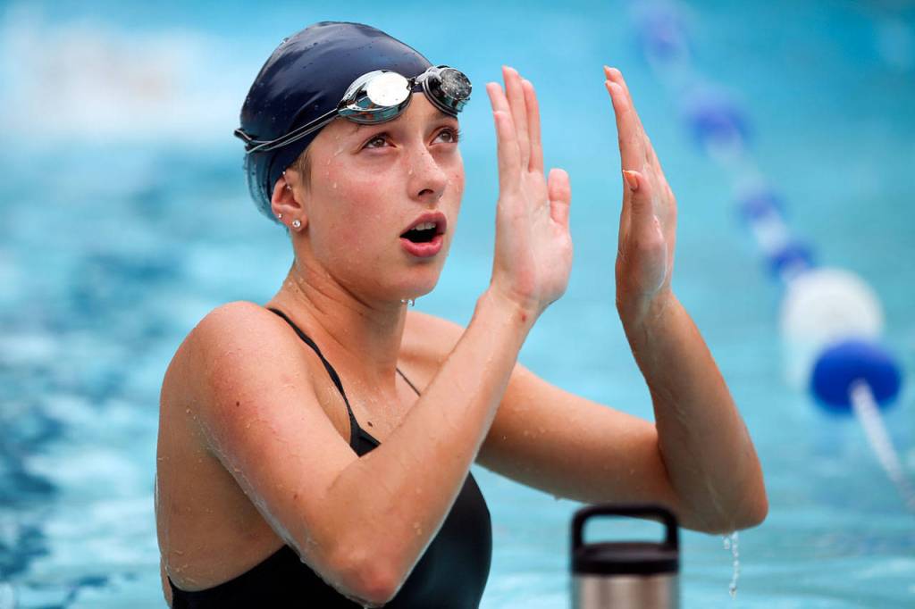 Edmonds-Woodway&rsquo;s Morgan Broadhead talks with teammates during practice Sept. 6, 2017, at Klahaya Swim and Tennis Club in Edmonds. (Kevin Clark / The Herald)