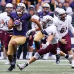 Washington&rsquo;s Dante Pettis returns a punt for a touchdown Saturday night at Husky Stadium in Seattle on September 9, 2017. Washington defeated Montana 63-7. (Kevin Clark / The Herald)