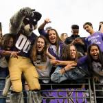Harry Husky celebrates with fans Saturday night at Husky Stadium in Seattle on September 9, 2017. Washington defeated Montana 63-7. (Kevin Clark / The Herald)