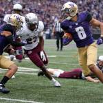 Washington&rsquo;s Dante Pettis returns a punt for a touchdown Saturday night at Husky Stadium in Seattle on September 9, 2017. Washington defeated Montana 63-7. (Kevin Clark / The Herald)