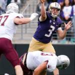 Washington&rsquo;s Jake Browning throws a pass despite Montana defensive pressure Saturday night at Husky Stadium in Seattle on September 9, 2017. Washington defeated Montana 63-7. (Kevin Clark / The Herald)