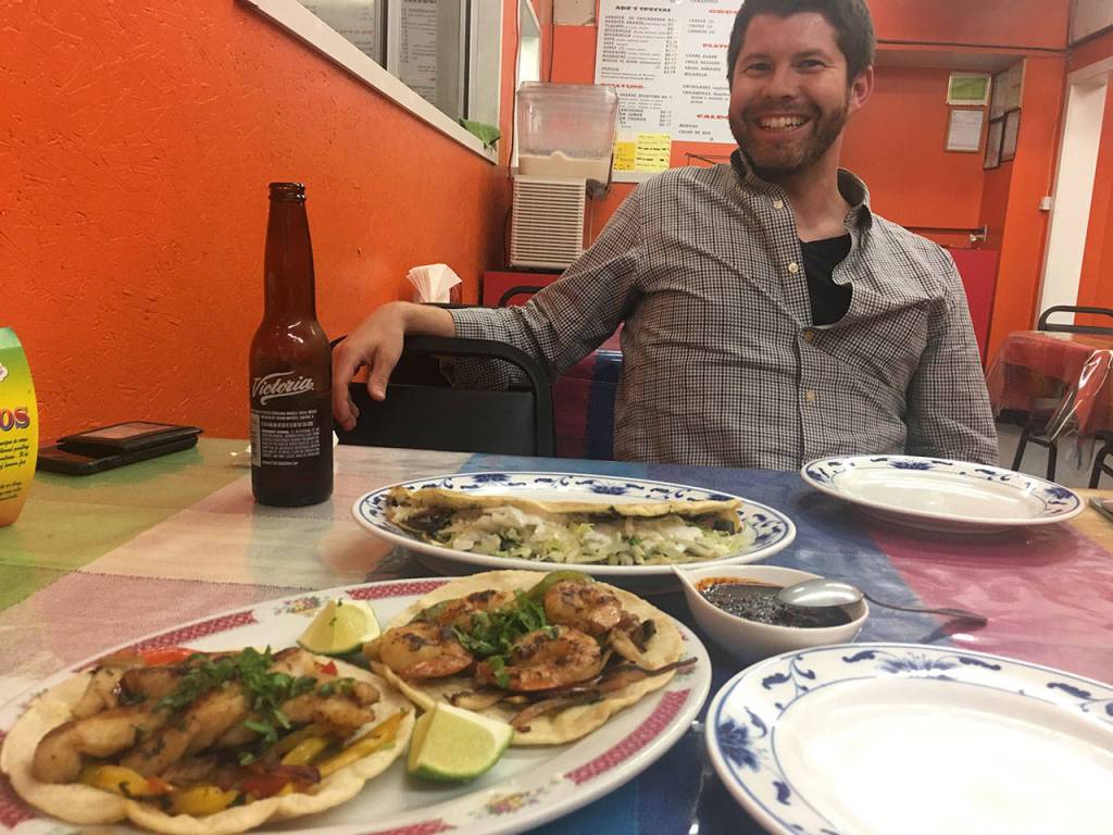 Trevor Lane of Seattle gets ready to settle in for a three-plate feast at Ade&rsquo;s Mexican Deli in Everett. (Ben Watanabe / The Herald)