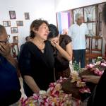 Family members grieve over the coffin containing the remains of 64-year-old Reynalda Matus during a wake in Juchitan, Oaxaca state, Mexico, on Saturday. Matus was killed when the pharmacy where she worked nights collapsed during Thursday&rsquo;s massive earthquake. (AP Photo/Rebecca Blackwell)