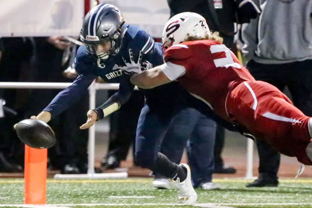 Glacier&rsquo;s Peak Ayden Ziomas reaches for the pylon and a touchdown against Snohomish&rsquo;s defender Keegan Stich at Veterans Memorial Stadium in Snohomish on Sept. 8. (Kevin Clark / The Herald)