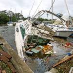 A sinking boat is surrounded by debris in the aftermath of Hurricane Irma at Sundance Marine in Palm Shores, Florida, on Monday. (Red Huber/Orlando Sentinel via AP)