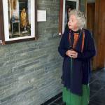 In this Dec. 2014 photo, American historian Nancy Hatch Dupree talks about a photo taken by National Geographic photographer Steve McCurry during an interview with The Associated Press at the Afghanistan Center at Kabul University. (AP Photo/Massoud Hossaini)