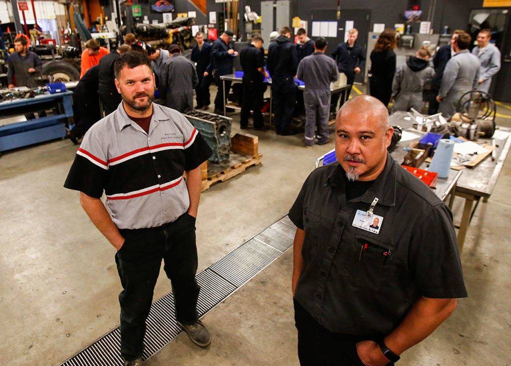 Diesel Power Technology instructor Brent Delfel (left) and Automotive Technology instructor Richie del Puerto are Sno-Isle Tech Center grads from 1990 and &lsquo;91 respectively. (Dan Bates / The Herald)