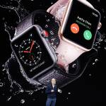 Apple CEO Tim Cook shows new Apple Watch Series 3 product at the Steve Jobs Theater on the new Apple campus on Tuesday in Cupertino, California. (AP Photo/Marcio Jose Sanchez)
