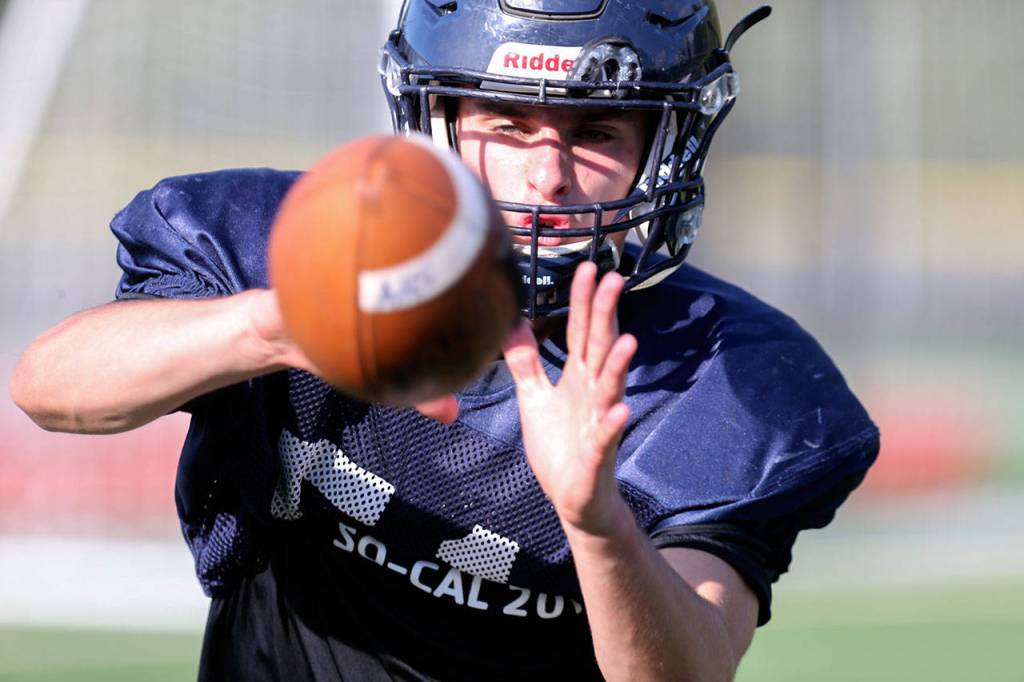 Arlington&rsquo;s Campbell Hudson eyes the ball for a reception during practice Sept. 13, 2017, at Arlington High School. (Kevin Clark / The Herald)