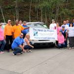 Staff and volunteers for The Hand Up Project celebrate their new van from Community Transit&rsquo;s Van GO program. (Contributed photo)