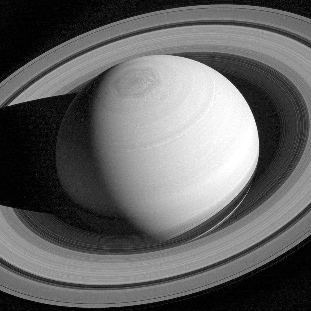 A persistent hexagonal cloud pattern on Saturn&rsquo;s north pole, as seen from the Cassini spacecraft in 2014. The hexagon is similar to Earth&rsquo;s polar vortex, which has winds blowing in a circular pattern around the polar region, and is nearly 25,000 kilometers (15,000 miles) across. Nearly four Earths could fit inside it. (NASA/JPL-Caltech/Space Science Institute via AP)