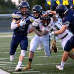 Arlington&rsquo;s Trevor Kazen hugs the sideline in route to the end zone and touchdown during a game on Sept. 15, 2017, at Arlington High School. (Kevin Clark / The Herald)