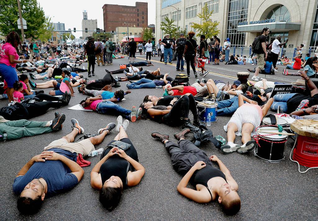 Demonstrators participate in a &ldquo;die-in&rdquo; outside the St. Louis Police Department headquarters on Sunday in response to a not-guilty finding in the trial of a former St. Louis police officer. (AP Photo/Jeff Roberson)