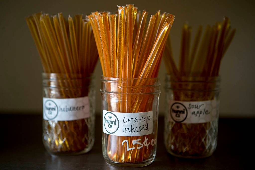Flavored honey treats are seen for sale at Hunni Company in Edmonds. (Ian Terry / The Herald)