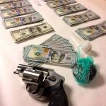 Edmonds police seized about a pound of methamphetamine and heroin, two guns and nearly $20,000 in cash from a man who was passed out in a minivan last week in a parking lot. (Edmonds Police Department)