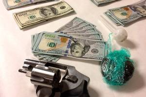 Man arrested after police find van full of drugs, cash and guns