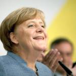 German Chancellor Angela Merkel arrives for a statement on the parliament election at the headquarters of the Christian Democratic Union CDU in Berlin, Germany, on Sunday. (Joerg Carstensen/dpa via AP)