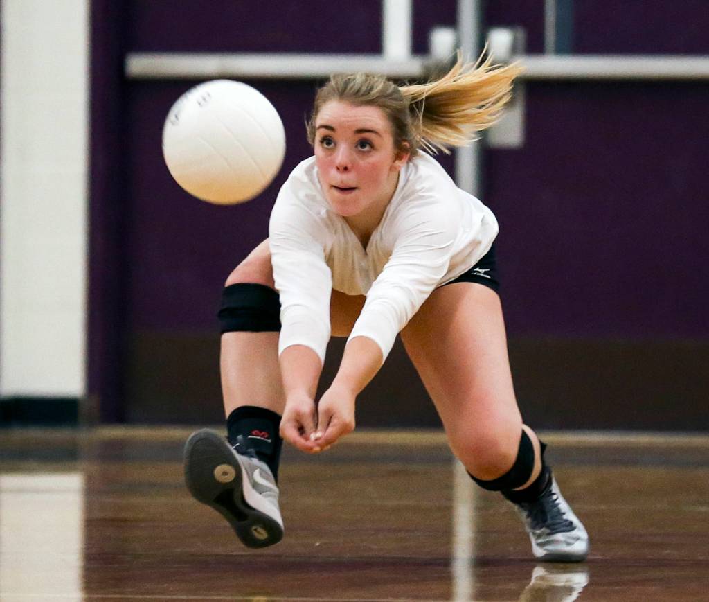Lake Stevens Payton Ludwig makes a dig off a serve at Lake Stevens High School on Sept. 20. Lake Stevens defeated Glacier Peak, 3-0. (Kevin Clark / The Herald)