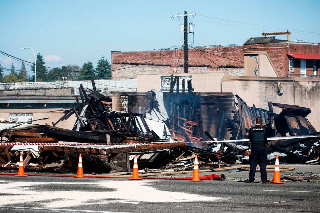 Burnt debris from Everett Office Furniture, on Broadway in Everett, is seen Tuesday. (Ian Terry / The Herald)
