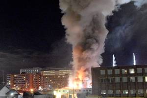 Investigators probe smoldering rubble in downtown Everett