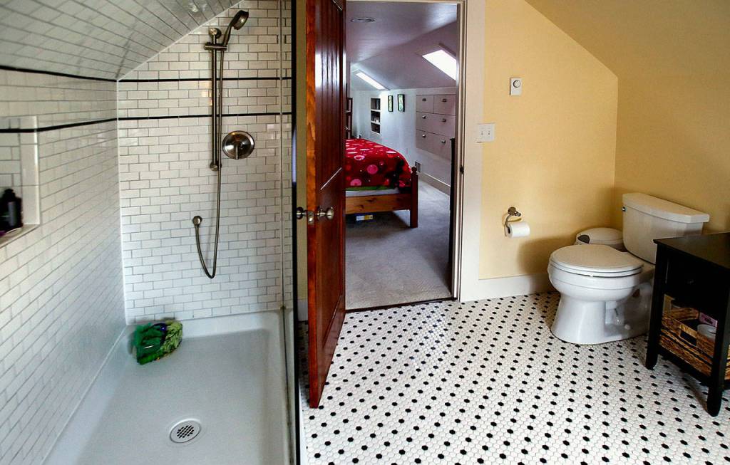 Everett-based Classic Remodeling NW Inc. built a new bathroom adjacent to Maria and Robert Coghills upstairs master bedroom. (Dan Bates / The Herald)