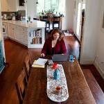 Thanks to some serious remodeling on the interior of a house with a lot of small rooms, Maria Coghill (at table) and her family now enjoy more open and airy settings through much of it. (Dan Bates / The Herald)