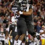 Washington State running back Jamal Morrow (25) celebrates his touchdown with offensive lineman Frederick Mauigoa (69) during the first half of a game against Southern California on Sept. 29, 2017, in Pullman, Wash. (AP Photo/Young Kwak)