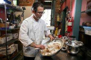 Chef James Abbott makes Bucks peanut butter pie at Bucks American Cafe in Everett. (Kevin Clark / The Herald)