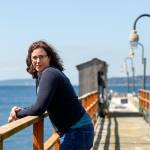 Shallin Busch takes a breather out on the pier at the NOAA facilites just north of the ferry terminal in Mukilteo. Busch conducts research on ocean acidification affects on marine species, including the Dungeness crab. (Dan Bates / The Herald)