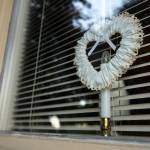 Hearts hang in each window of Jeff and Fran Trues Beverly Boulevard home in Everett. (Ian Terry / The Herald)