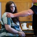 A Snohomish County Corrections officer takes Amy Brown from the courtroom following sentencing Tuesday by Superior Court Judge Michael Downes. (Dan Bates / The Herald)
