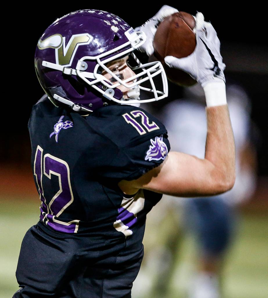 Lake Stevens Austin Murren hauls in a pass during a game against Jackson at Lake Stevens High School on Sept. 29. (Ian Terry / The Herald)