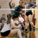 Stanwoods Emma Bash (far right) celebrates a kill over Edmonds-Woodways Betty Abraham (center), with Edmonds-Woodways Sam Hardan missing a dig with Stanwoods Saylor Anderson (far left) looking on at Edmonds-Woodway High School in Edmonds on Sept. 28. Starwood won in straight set. (Kevin Clark / The Herald)